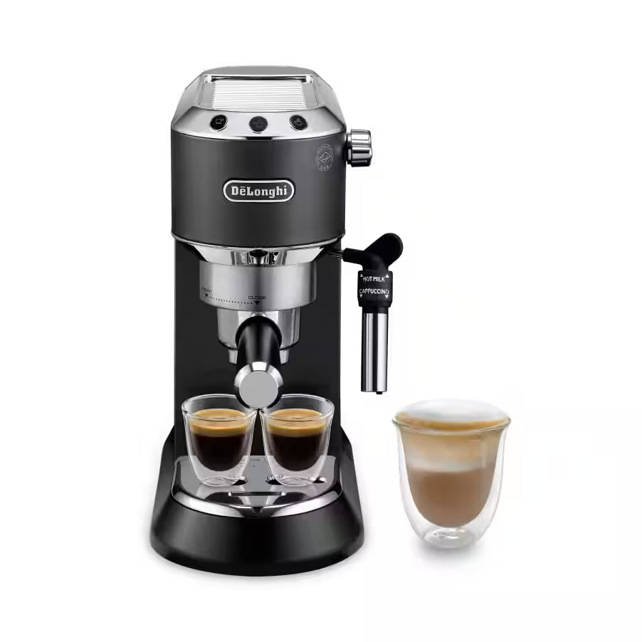 De'Longhi Dedica Style Espresso Machine EC685 brewing espresso with steam wand and sleek black finish on a kitchen countertop.