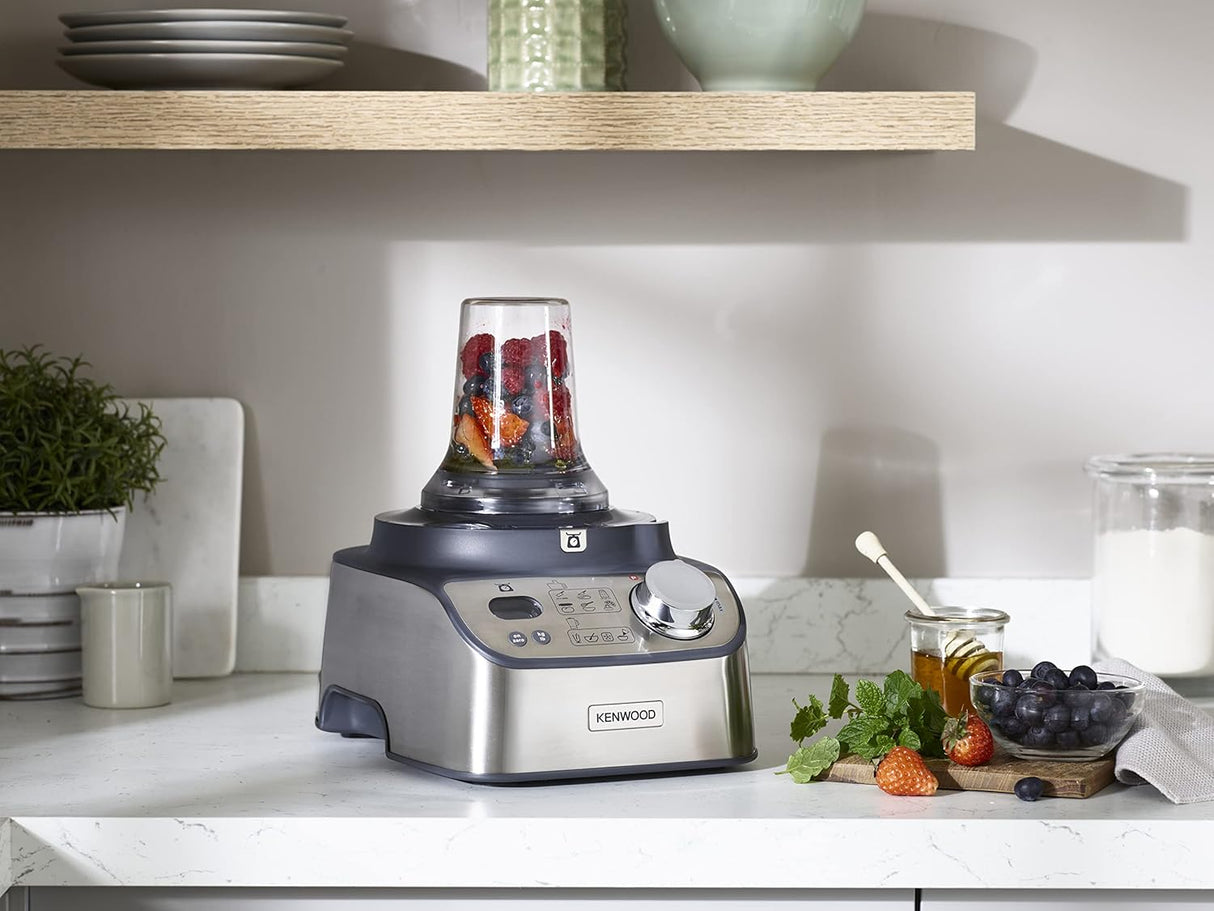 Kenwood blender on a kitchen counter with ingredients around