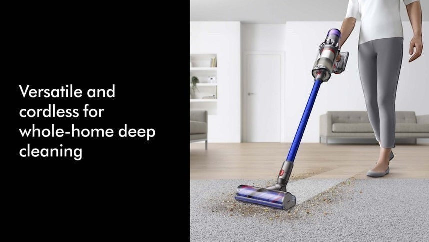 Taghareed cordless vacuum cleaner with purple accents and blue wand cleaning carpet and hardwood floors.