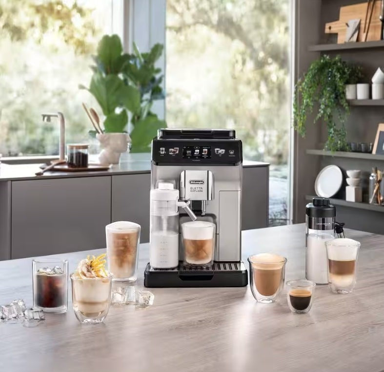 Taghareed De’Longhi Eletta Explore automatic coffee machine with milk carafe, making hot and cold coffee drinks.