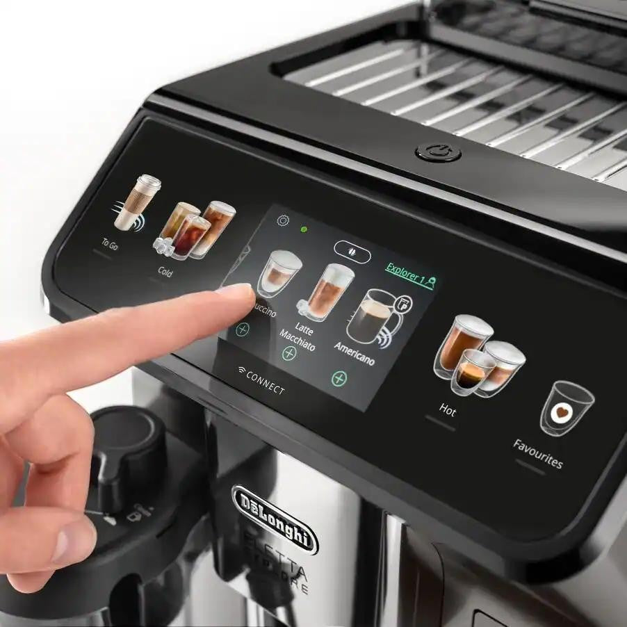 Taghareed De'Longhi Eletta Explore automatic coffee machine with touch screen showing hot and cold brew options.