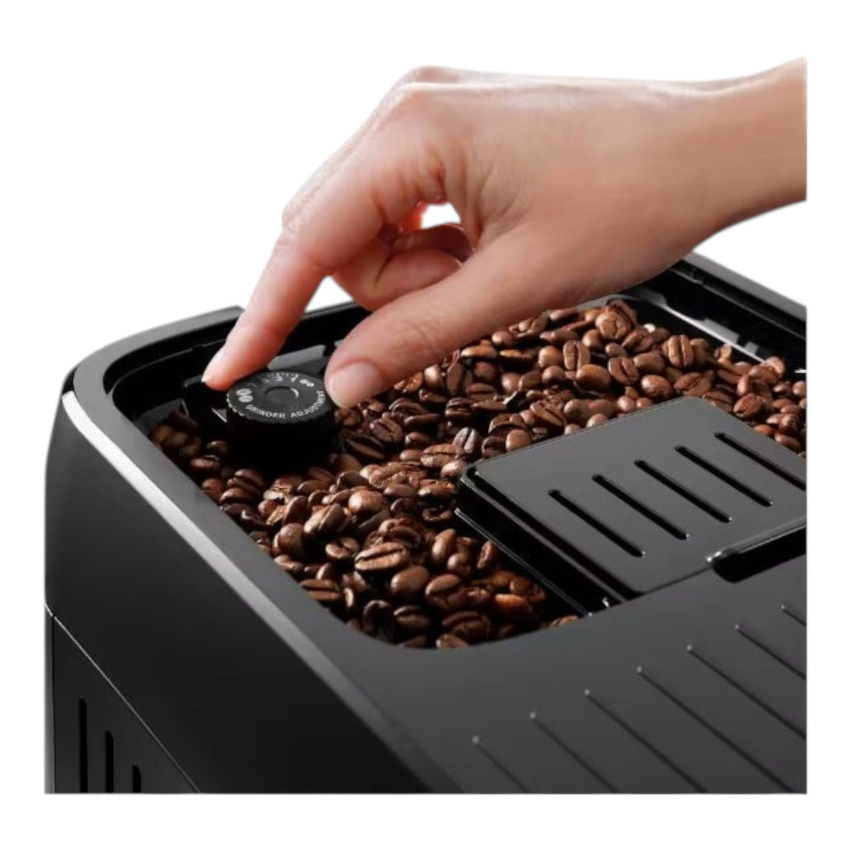 Taghareed De'Longhi Magnifica Evo coffee machine with grinder adjustment dial and coffee beans.