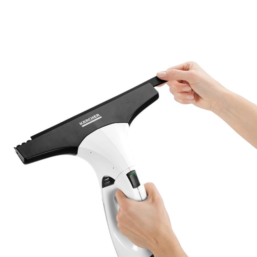 Taghareed Kärcher Window Vac WV 2 Plus cordless window cleaner in white and black, with a hand adjusting the squeegee.