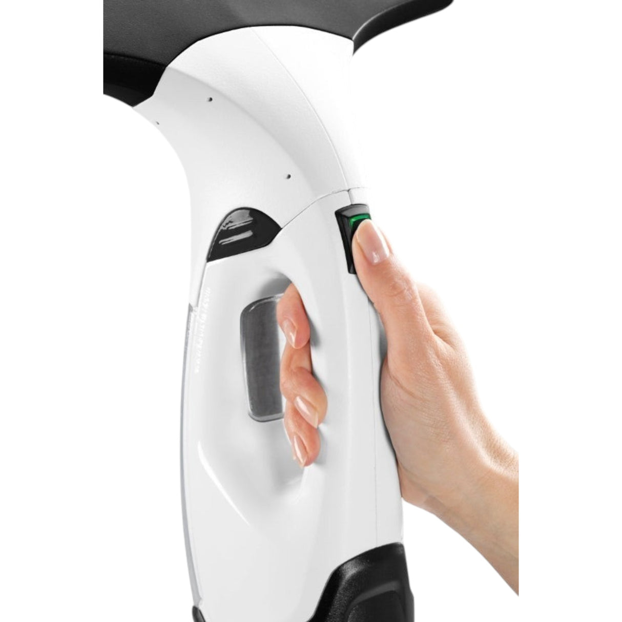 Taghareed Kärcher Window Vac WV 2 Plus cordless window cleaner, white, with a hand pressing the green power button.