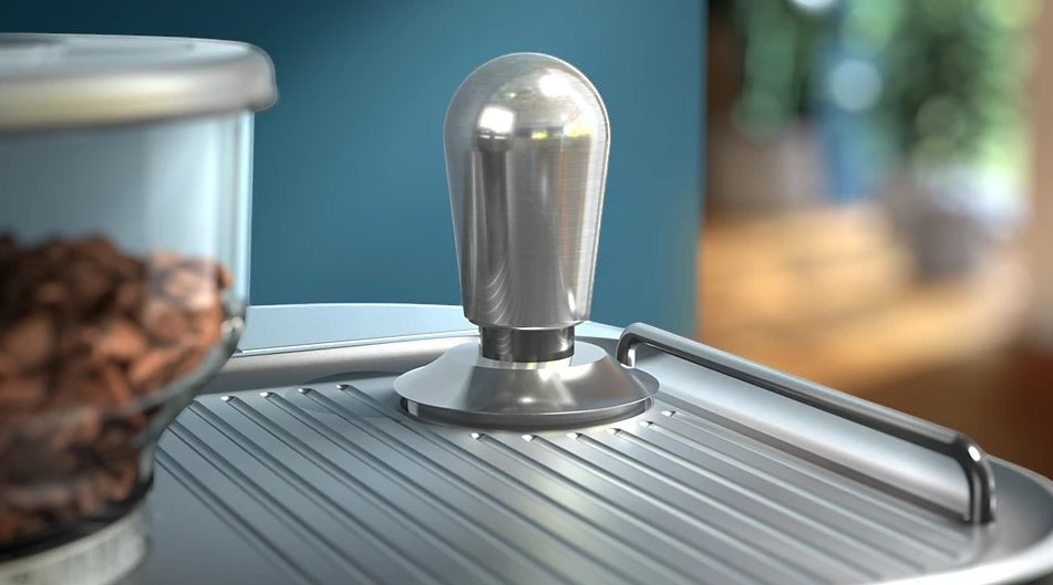 Taghareed Philips Barista Brew espresso machine tamper with stainless steel finish and ribbed drip tray.