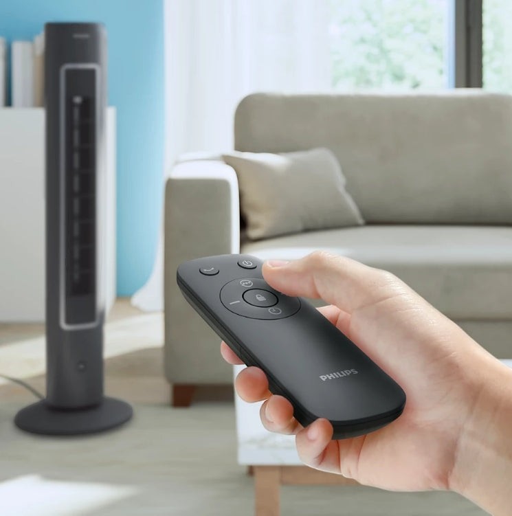 Taghareed Philips 5000 Series Tower Fan CX5535/11, dark grey, slim design, remote control in hand