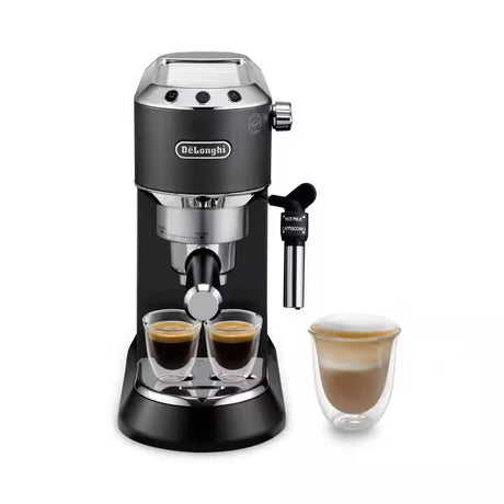 De'Longhi Dedica Style Espresso Machine EC685 brewing espresso with steam wand and sleek black finish on a kitchen countertop.
