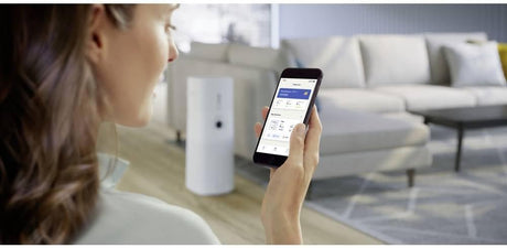 Philips Series 3000 2-in-1 air purifier and humidifier with digital display and sleek white design in front of a modern background.