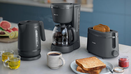 Philips Essentials Collection Toaster 1000 Series HD2510/90 with two slices and adjustable browning control, black finish.