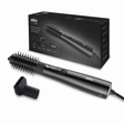 Braun hair styling brush with a round brush attachment and a nozzle attachment, shown in front of its black retail box on a white background.