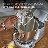 Kitchen mixer with integrated easyweigh scales being used to measure flour.