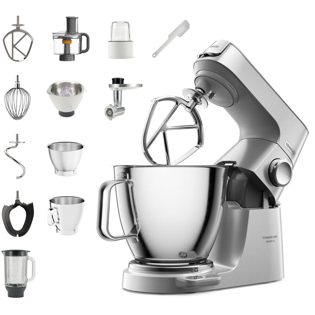 Kitchen stand mixer with various attachments on a white background
