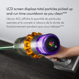 Hand holding a cordless vacuum cleaner with an LCD screen displaying cleaning information.
