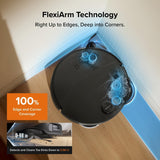 Robotic vacuum cleaner with FlexiArm Technology cleaning a corner on a wooden floor.