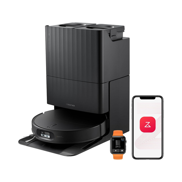 A black robotic vacuum cleaner shown with its matching charging dock/base, plus a smartphone displaying a companion app and a smartwatch with an orange band. The products are photographed on a clean white background.