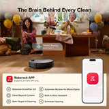 Roborock robot vacuum cleaning a room with people celebrating in the background, featuring the Roborock app on a smartphone.