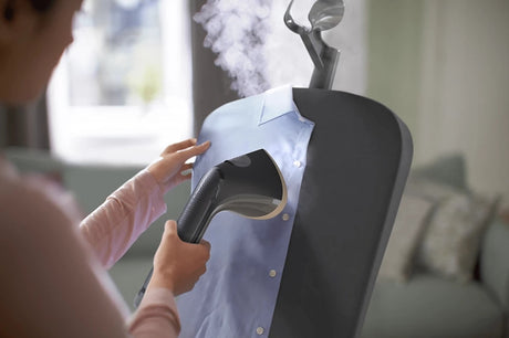 Philips Stand Steamer 3000 Series with Tilting StyleBoard, shown in a home setting, featuring the steamer and adjustable board.