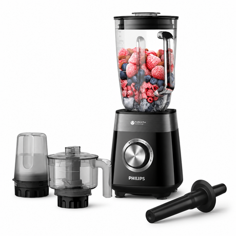 Taghareed Philips 5000 Series blender with 2L glass jar filled with berries and ice, includes grinder and chopper attachments.