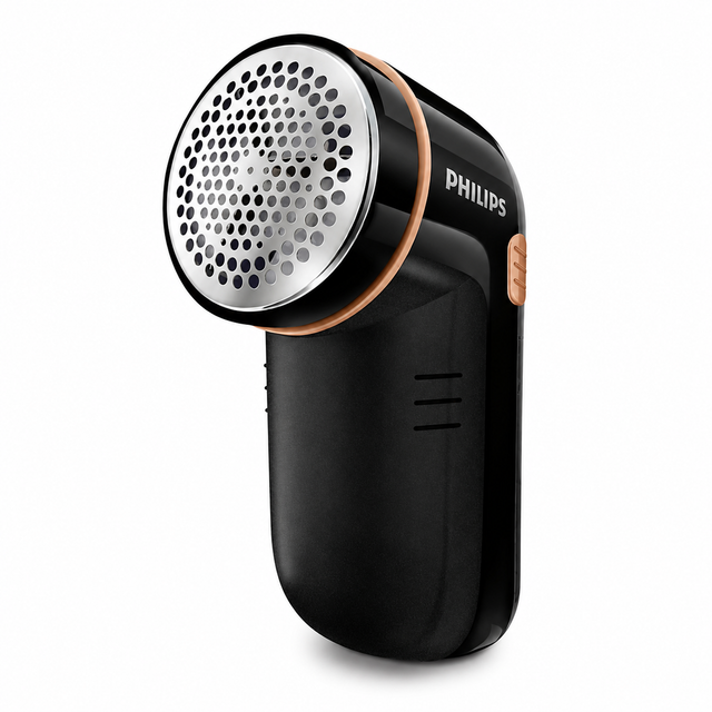 Taghareed Philips Fabric Shaver GC026/80, black with gold accents, includes batteries and cleaning brush.