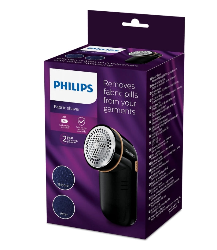 Taghareed Philips Fabric Shaver GC026/80, black with gold accents, includes batteries and cleaning brush.