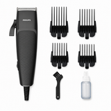 Taghareed Philips Hairclipper Series 3000 HC3100/13 corded hair clipper with 4 combs, cleaning brush, and oil bottle.