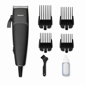 Taghareed Philips Hairclipper Series 3000 HC3100/13 corded hair clipper with 4 combs, cleaning brush, and oil bottle.