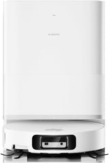 A white Xiaomi robotic vacuum cleaner docked at its matching white charging station, shown against a plain white background.