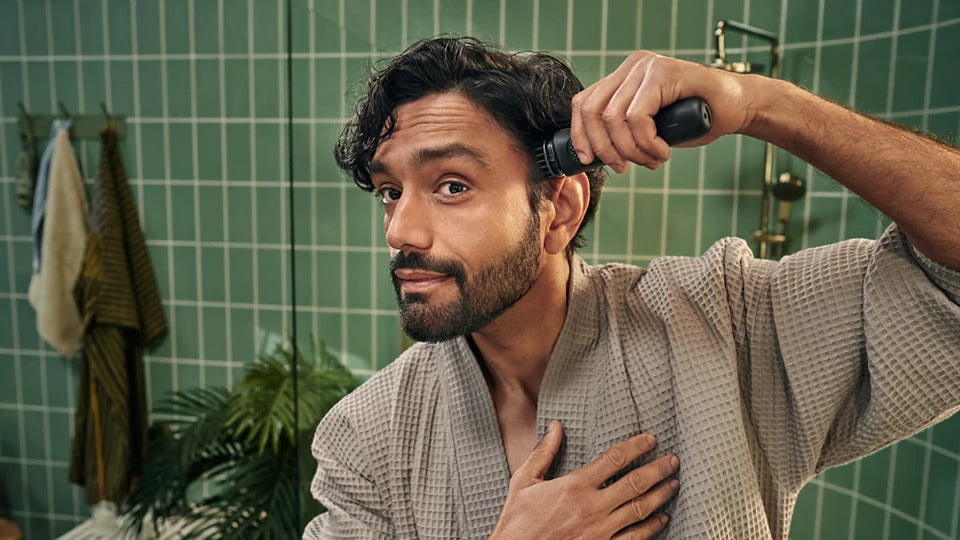 Taghareed Philips Multigroom Series 3000 MG3930/15 all-in-one trimmer with 7 attachments, including beard combs, nose trimmer, and USB charging cable.