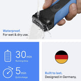 Braun Series 3 310s black and blue electric shaver being rinsed under water. Features 30 min running time and 5 min quick charge.
