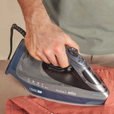 Braun TexStyle 9 Steam Iron SI9682DB with 3200W power and FreeGlide 3D soleplate, shown in use on a red shirt.