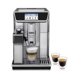 A De'Longhi Eletta Automatic Espresso Machine in stainless steel and black, shown with a glass of layered latte macchiato and two double-walled espresso cups on a white background.
