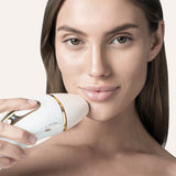 Braun Silk-expert Pro 5 IPL hair removal device with gold accents, showcasing its sleek design and treatment window.