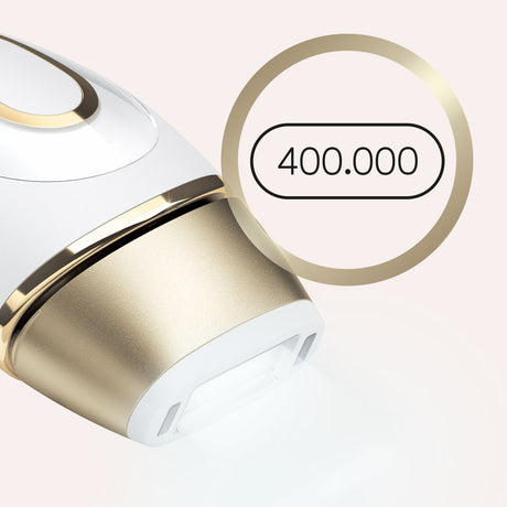 Braun Silk-expert Pro 5 IPL hair removal device in gold with sleek design for at-home hair removal treatments.