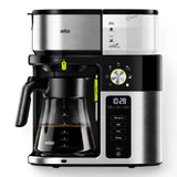 Taghareed Braun BrewSense Drip Coffee Maker KF9050BK, black and stainless steel, with glass carafe and digital display showing brew strength options.