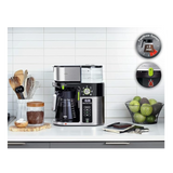 Taghareed Braun BrewSense Drip Coffee Maker KF9050BK, black and stainless steel, with 10-cup glass carafe and digital display.
