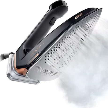 Taghareed Braun CareStyle 7 Pro steam generator iron with FreeGlide 3D technology and EloxalPlus coating, emitting steam.