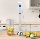 Taghareed Braun MultiQuick 1 hand blender, white with blue button, stainless steel shaft, with fruit in beaker and on plate.