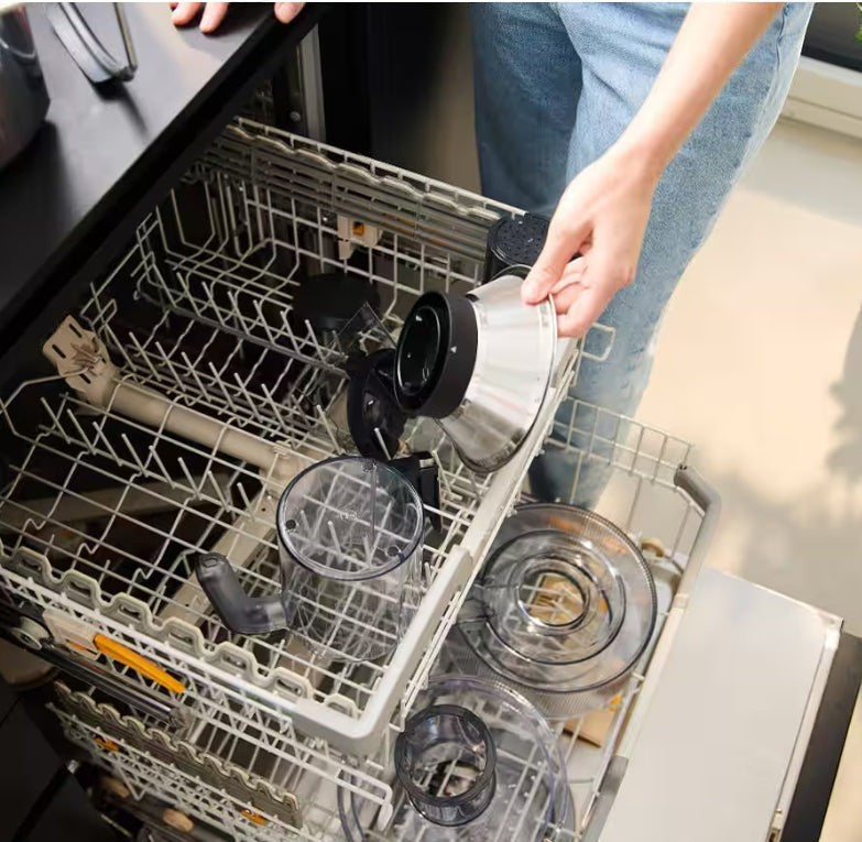 Taghareed Braun MultiJuice 7 Spin Juicer SJ7000 parts being placed in a dishwasher. Stainless steel and clear plastic components.