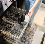 Taghareed Braun MultiJuice 7 Spin Juicer SJ7000 parts being placed in a dishwasher. Stainless steel and clear plastic components.
