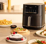 Braun MultiFry 5 air fryer 2-in-1 with digital display, 6L capacity, cooking fries, pizza, cake, and steak.