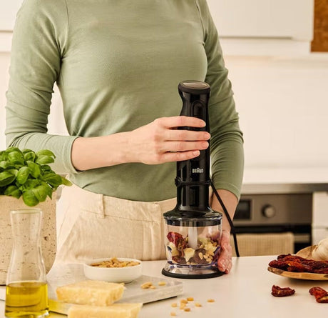 Taghareed Braun MultiQuick 3 hand blender with 900W motor, 2 speeds, and 350ml chopper for making pesto.
