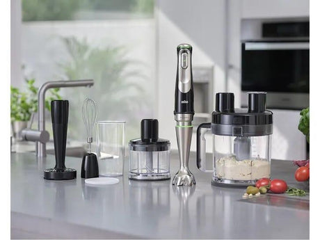 Braun MultiQuick 9 hand blender with stainless steel shaft and 10 accessories on a kitchen counter.