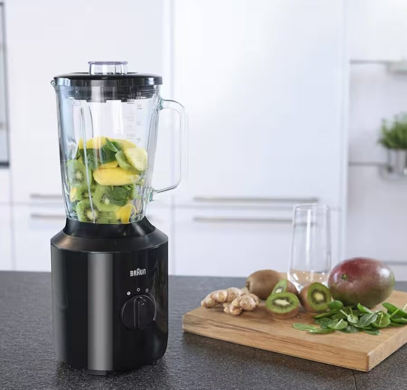 Taghareed Braun PowerBlend 3 jug blender in black, with glass jug filled with kiwi and mango, ready for blending.