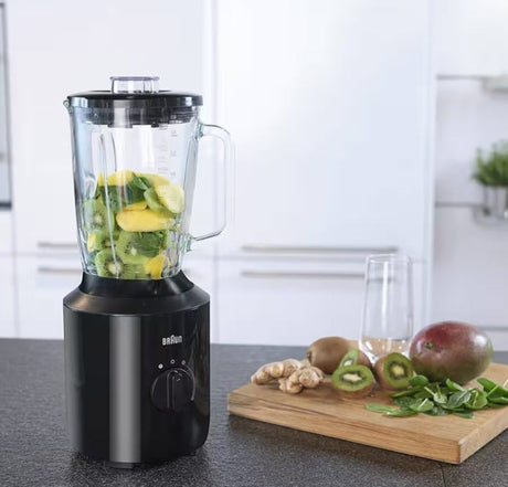 Taghareed Braun PowerBlend 3 jug blender in black, with glass jug filled with kiwi and mango, ready for blending.