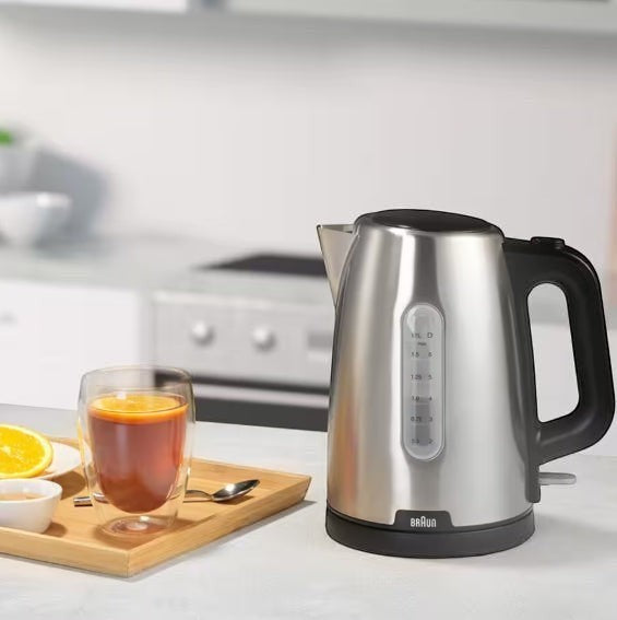 Taghareed Braun PurShine stainless steel electric kettle, 1.7L capacity, 2200W, with water level indicator and black handle.
