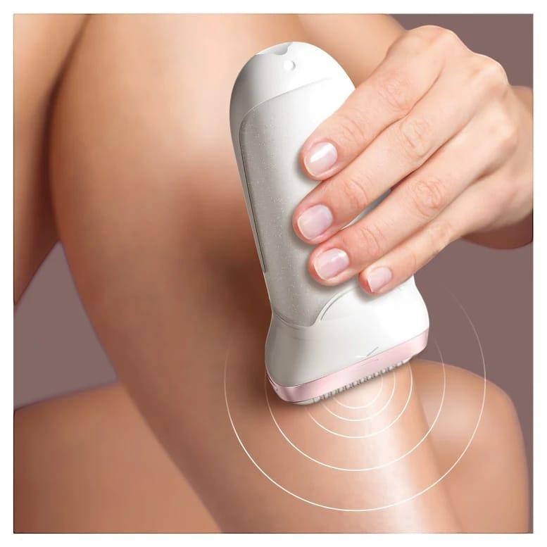Braun Silk-épil 9 epilator with white and pink accents being used on a leg. Features include SensoSmart technology.