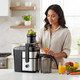 Taghareed CONTI 1000W juice extractor with 2 speeds and 1.25L capacity, stainless steel and black finish.