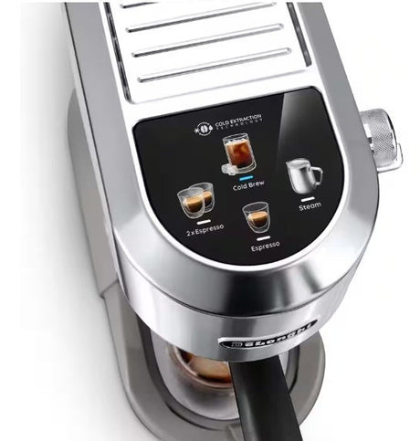 Taghareed De'Longhi Dedica Duo espresso machine in stainless steel with buttons for Cold Brew, Espresso, and Steam.