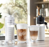 Taghareed De’Longhi Eletta Explore coffee machine with LatteCrema Hot & Cool systems, serving hot and cold coffee drinks.