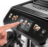 Taghareed De’Longhi Eletta Explore coffee machine touchscreen showing hot and cold drink options. A finger touches the screen.